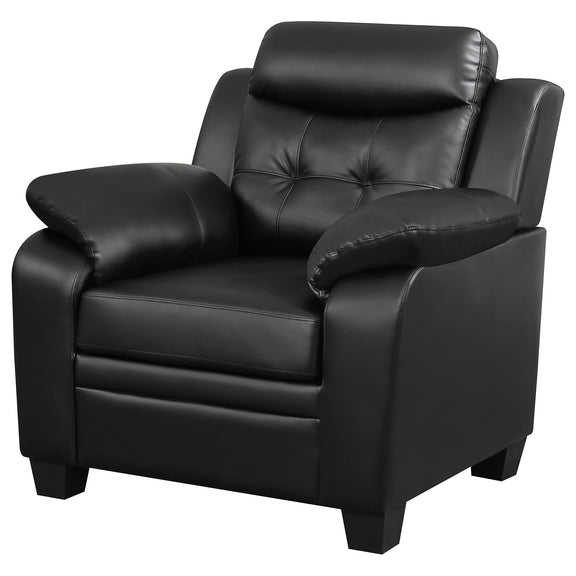 Black upholstered accent chair with tufted back, padded arms, and thick cushioned seat