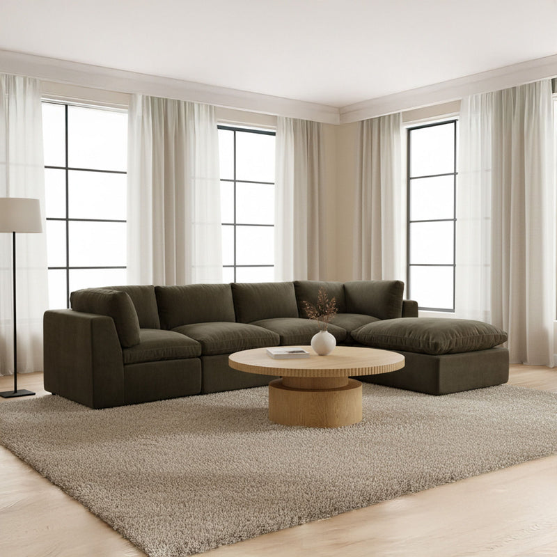 Dark green modular sectional sofa with chaise, rounded arms, deep seat cushions