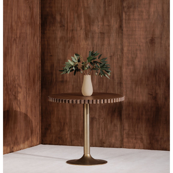 Round cafe table with dark brown scalloped tabletop and gold pedestal base