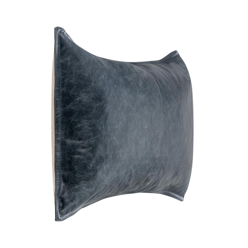 Blue leather lumbar pillow side view with center seam and curved edge.