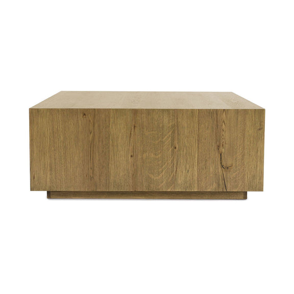 Square coffee table in light brown wood with smooth tabletop and low caster-style base