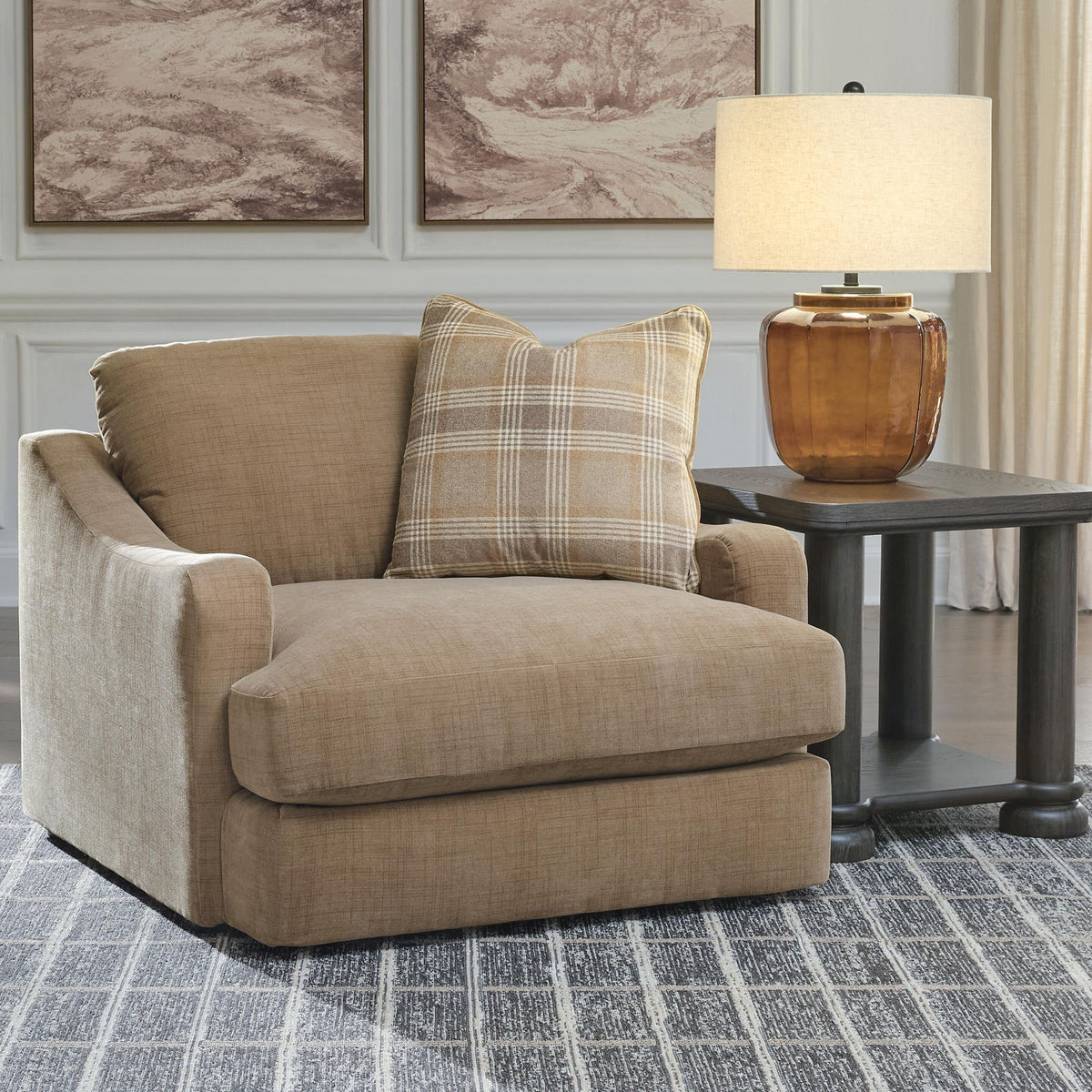Tan chair and a half with plaid lumbar pillow and matching seat cushion