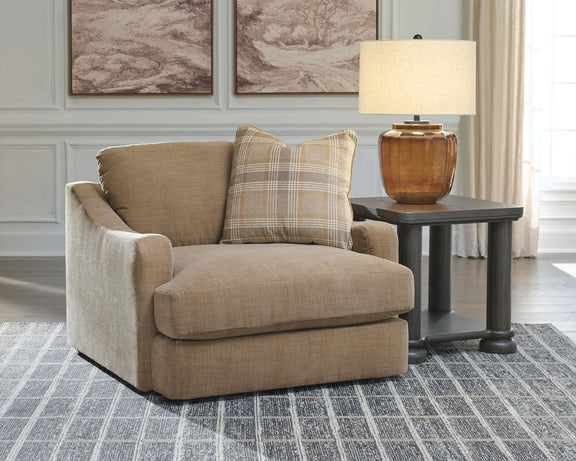 Tan chair and a half with plaid lumbar pillow and matching seat cushion
