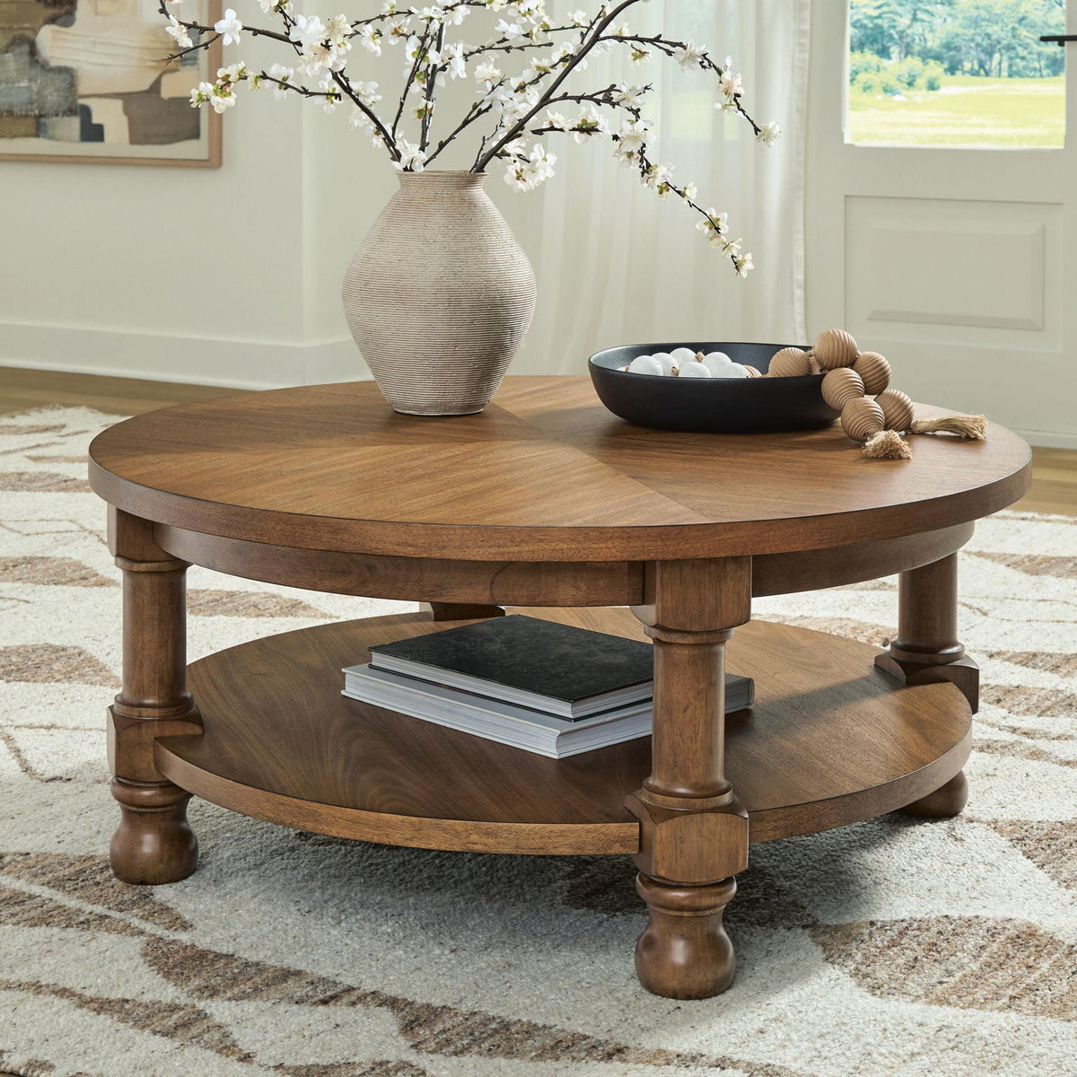 Chadworth - Round Cocktail Table - Medium Brown