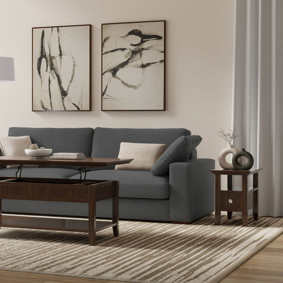 Brown narrow side table with drawer and open shelf beside a sofa