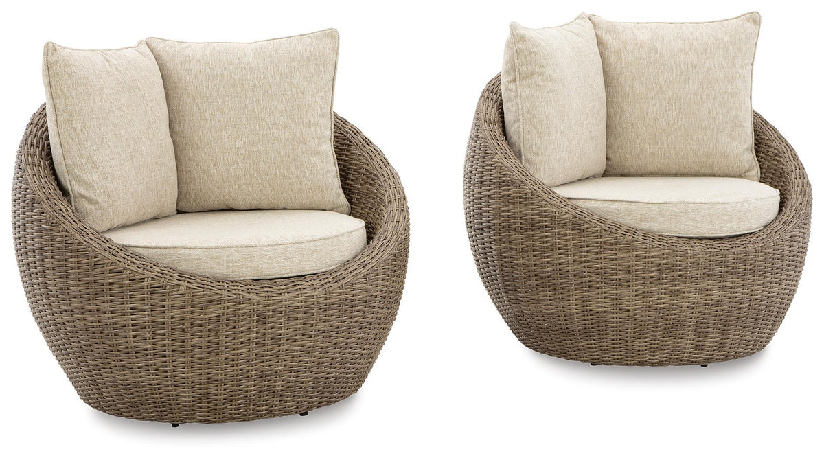 Beige swivel lounge chair with seat and back cushion, woven wicker base