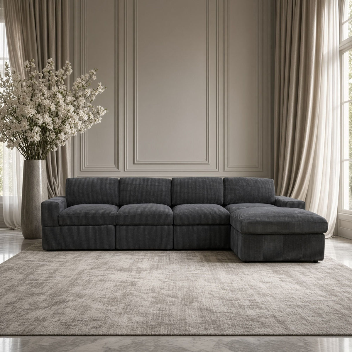 Dark gray modular sectional sofa with chaise ottoman and padded backrest blocks