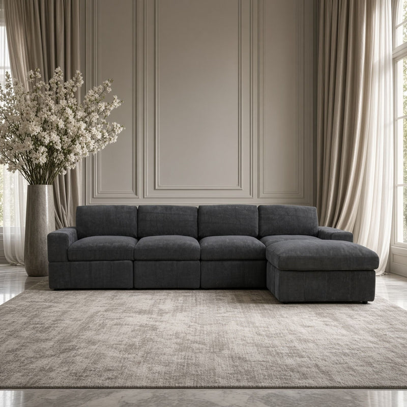 Dark gray modular sectional sofa with chaise ottoman and padded backrest blocks