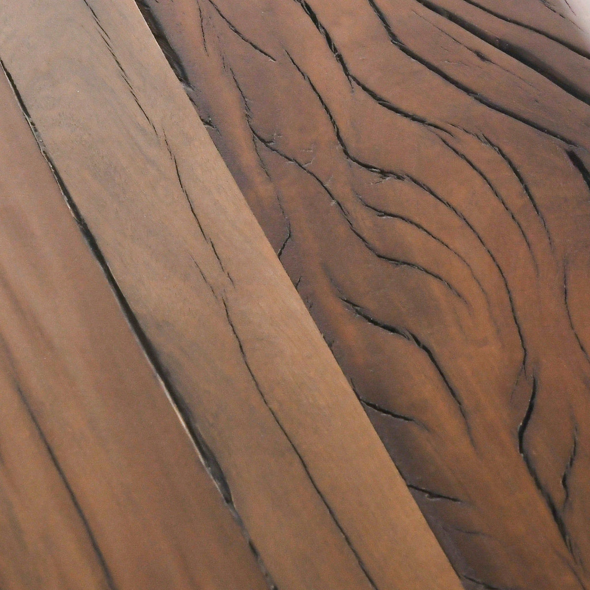 Reclaimed wood tabletop surface with dark grain lines and natural texture