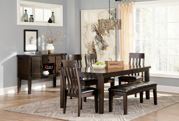 Dark brown dining side chair with vertical slat back and dark upholstered seat