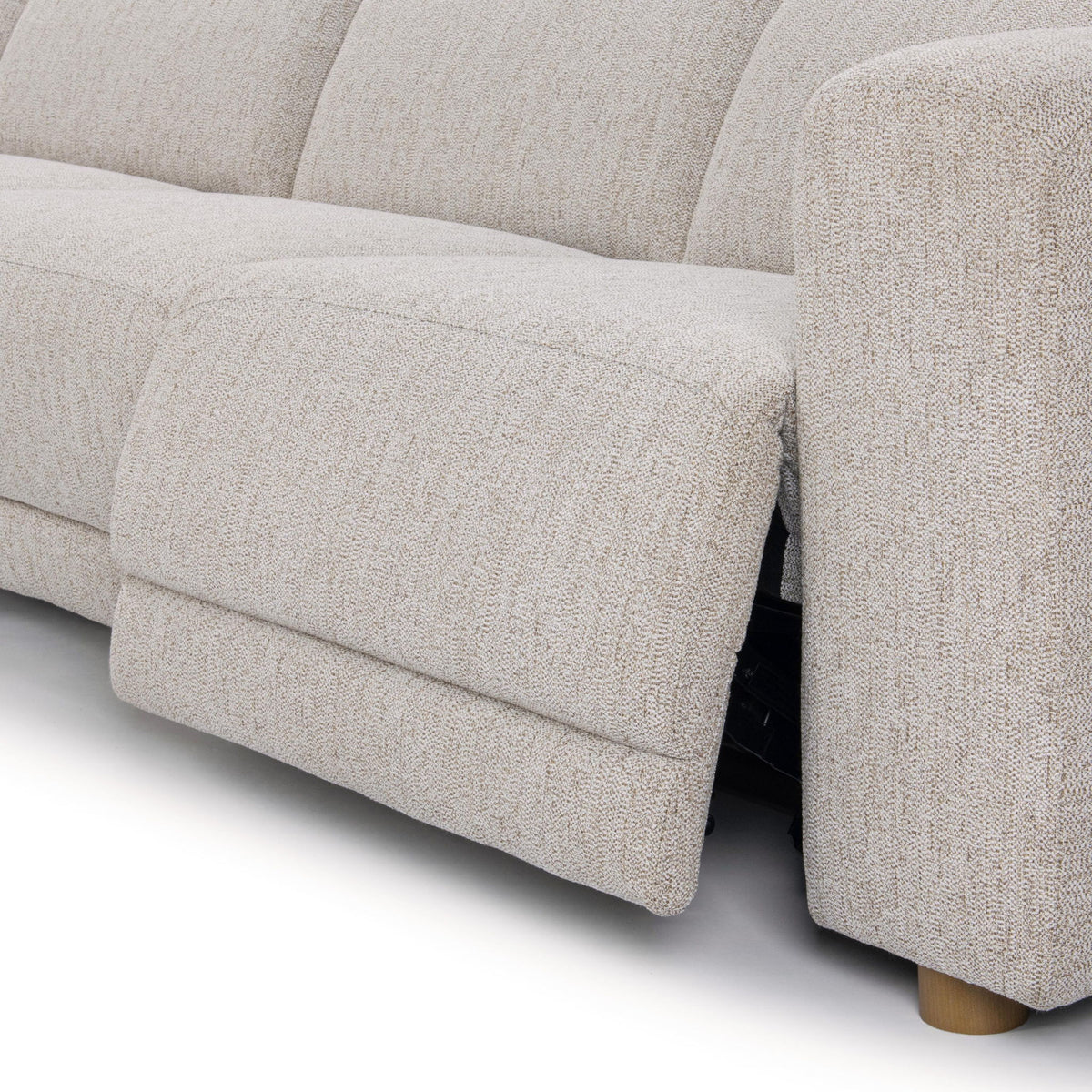 Close-up of light gray upholstery on a sectional sofa arm and seat cushion