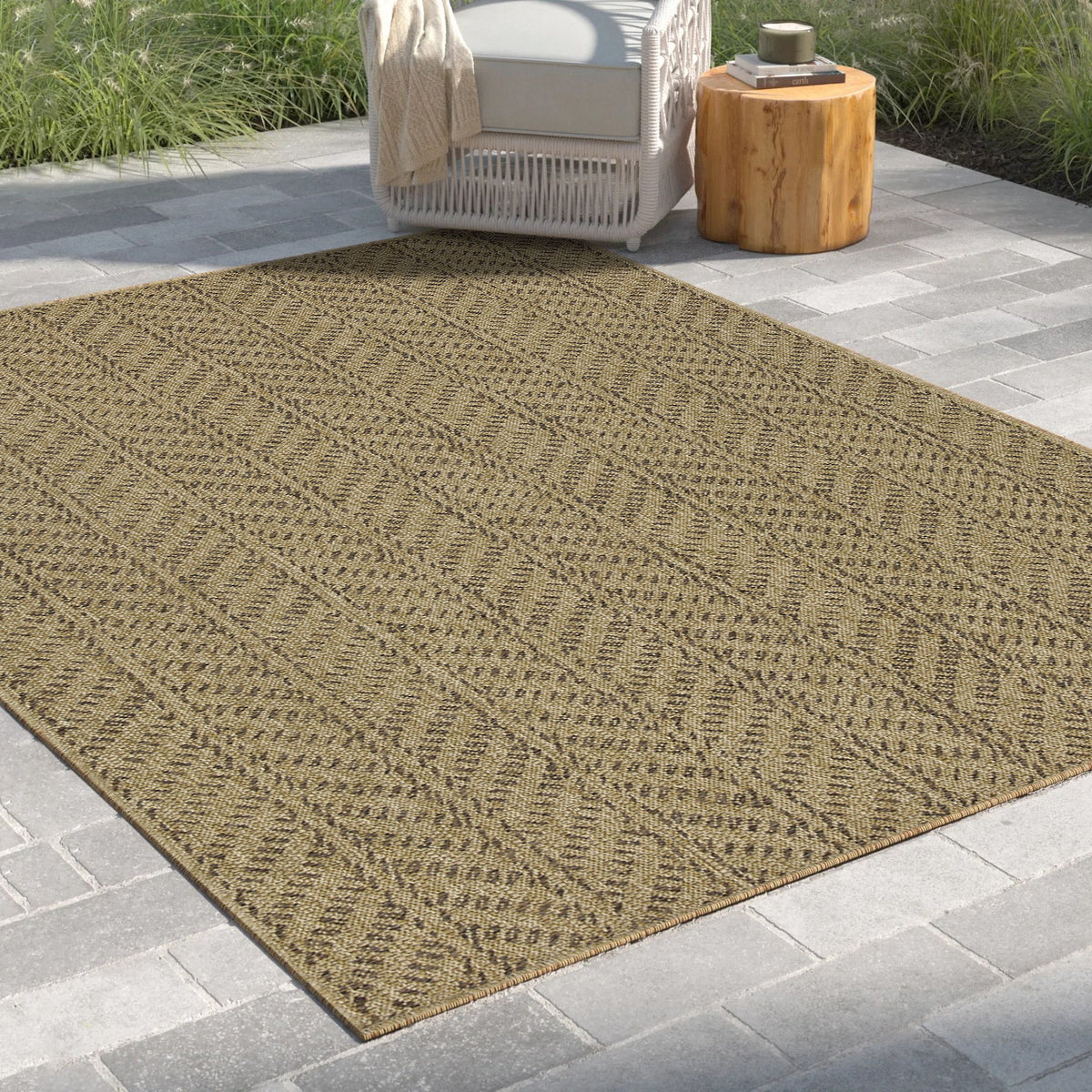 Light brown chevron-pattern area rug with flat woven texture, angled view