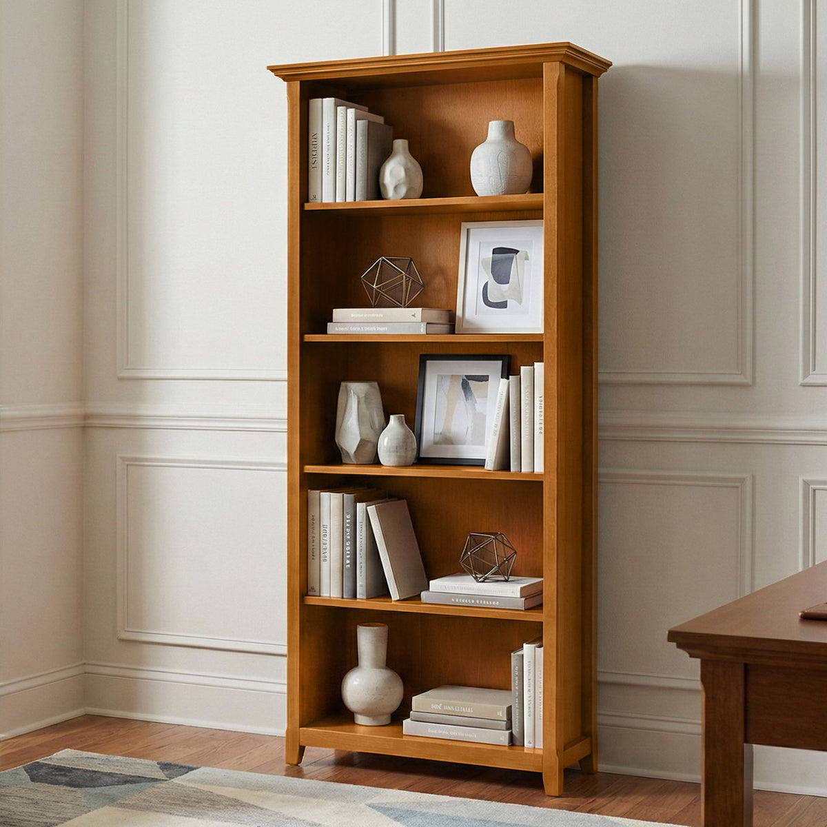 Light brown wood 5-shelf bookcase with open compartments and slatted sides.