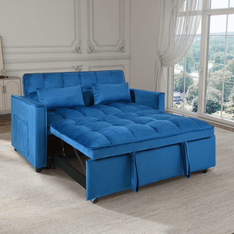 Blue convertible sofa bed with tufted seat cushions and pull-out mattress on caster feet