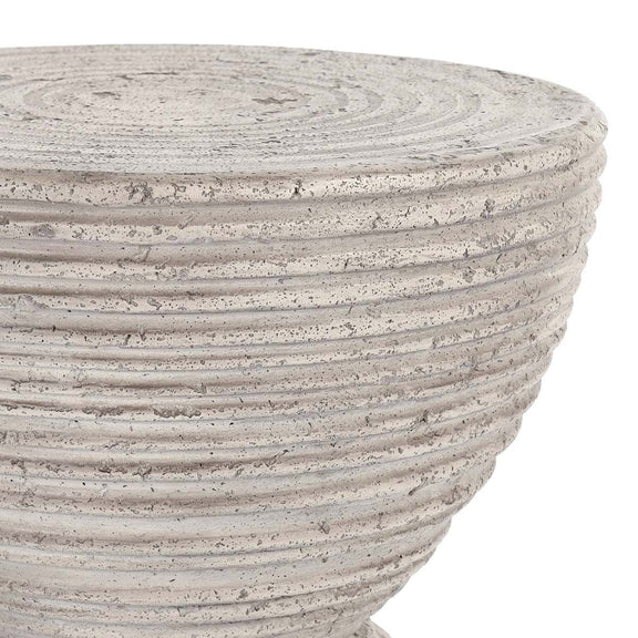 Light gray hourglass outdoor accent table top with speckled ribbed concrete finish