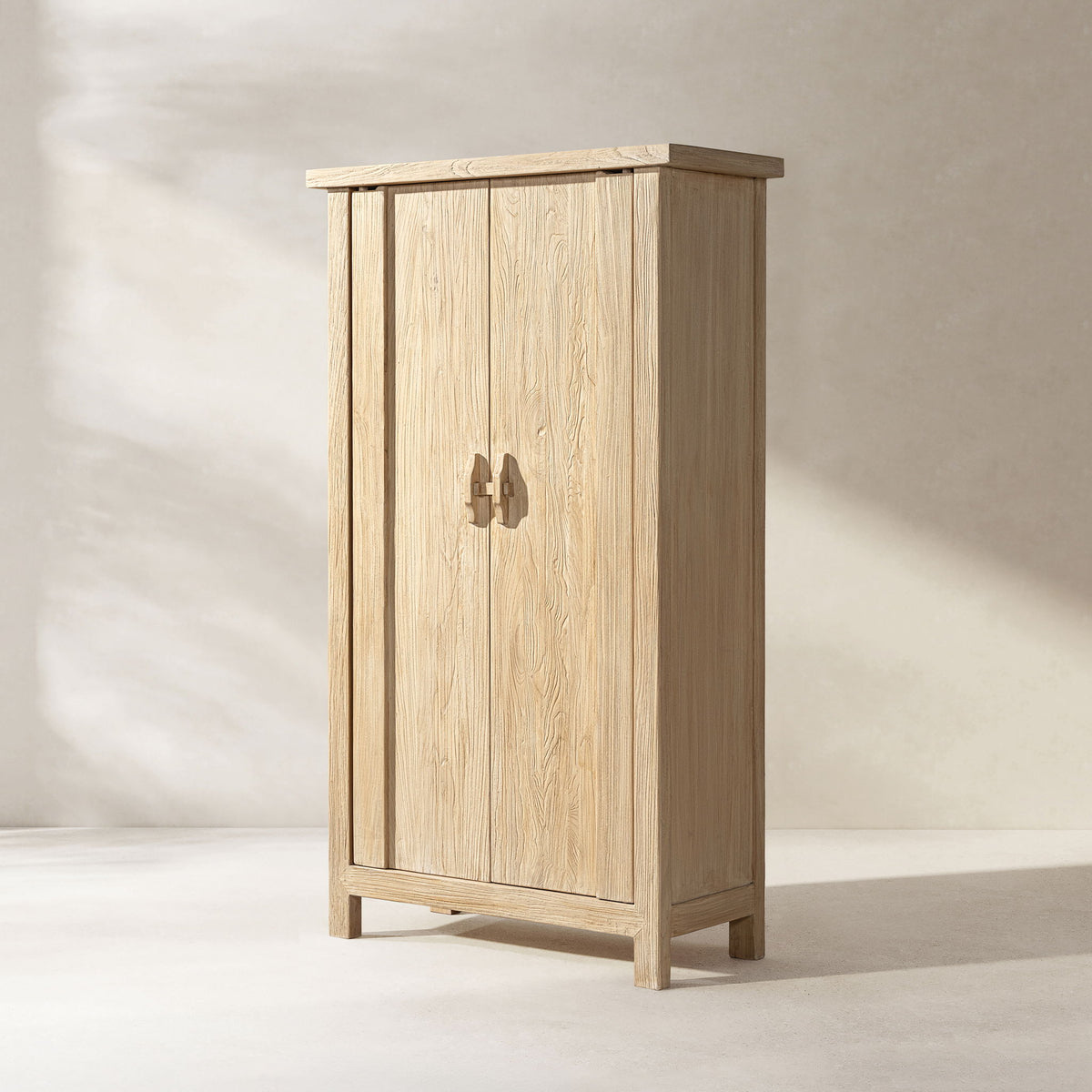 Light natural brown two-door storage cabinet, shown at an angle with its side visible