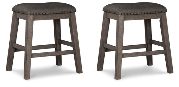 Pair of gray upholstered stools with round padded seats and X-back supports