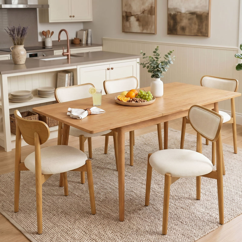 Beige upholstered dining chairs with curved backs around a wooden dining table