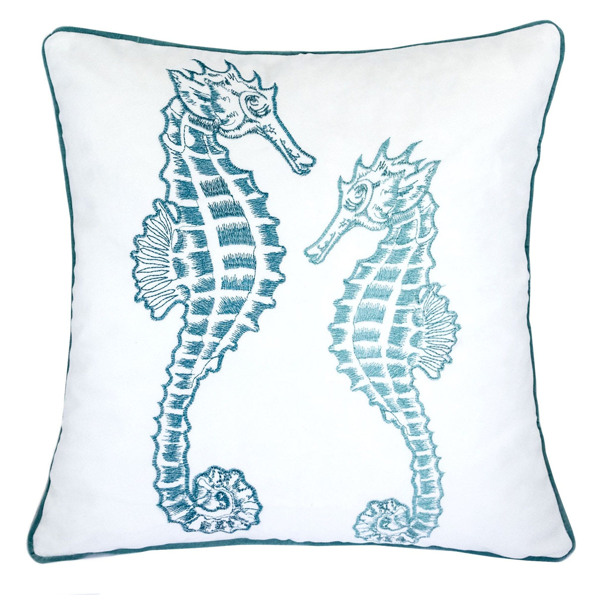 White pillow cover with teal-blue seahorse embroidery and teal piped border