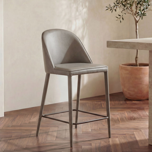 Gray vegan leather counter stool with padded seat, curved back, and metal frame