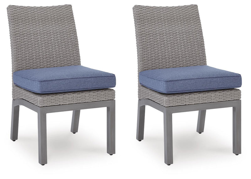 Two gray woven side chairs with blue cushions and gray legs