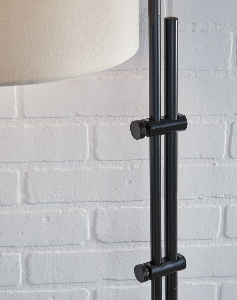 Black metal lamp pole with three evenly spaced arms and round mounting knobs.