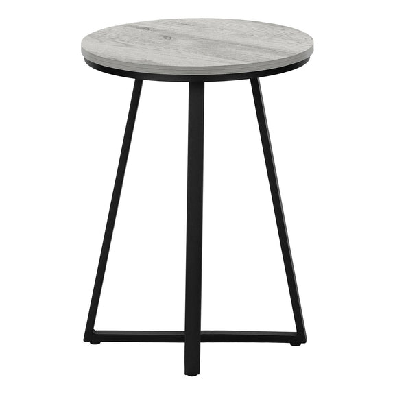 Light gray round accent side table with flat circular top and black tapered legs