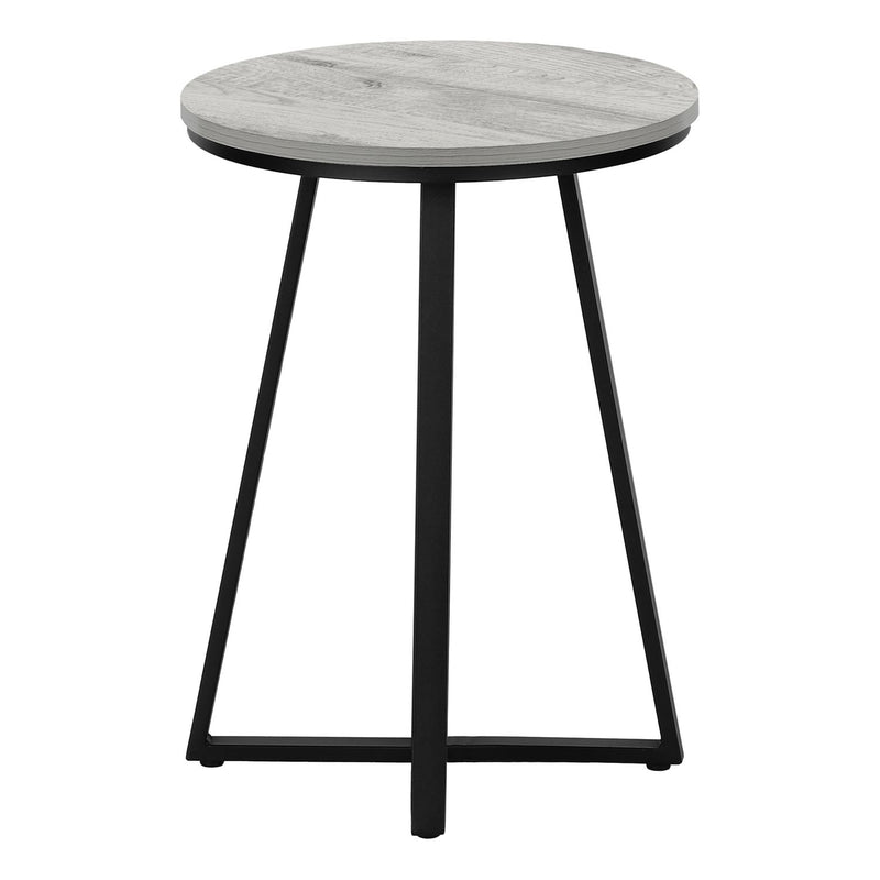 Light gray round accent side table with flat circular top and black tapered legs