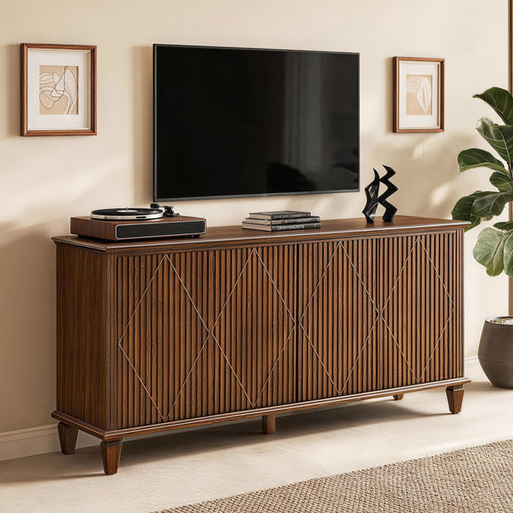 Walnut TV stand with carved geometric doors, shown beneath a television