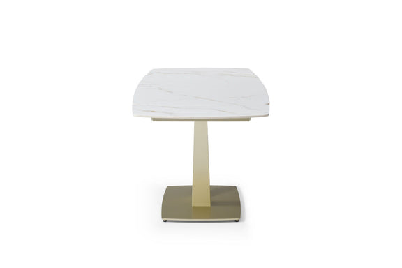 Dining table with rounded white marble-look top and gold pedestal base, front view
