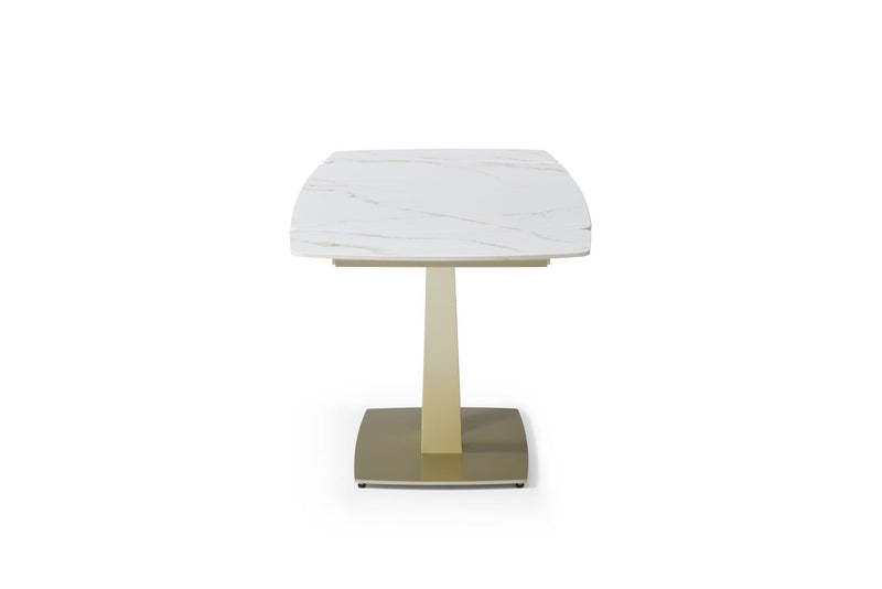 Dining table with rounded white marble-look top and gold pedestal base, front view