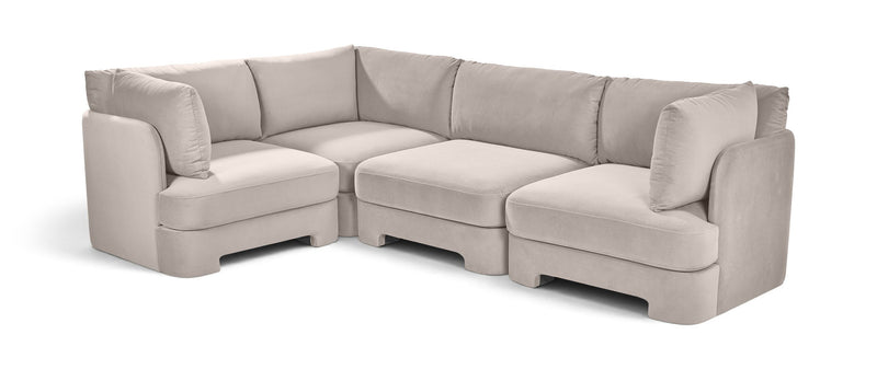 Beige velvet sectional sofa with upholstered arms, chaise corner, and matching cushions