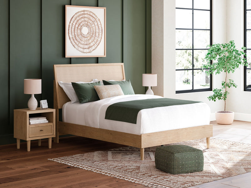 Beige panel bed with upholstered headboard, white bedding, and wooden frame