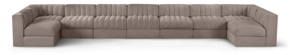 Light beige velvet modular sectional sofa with tufted cushions and curved armrests