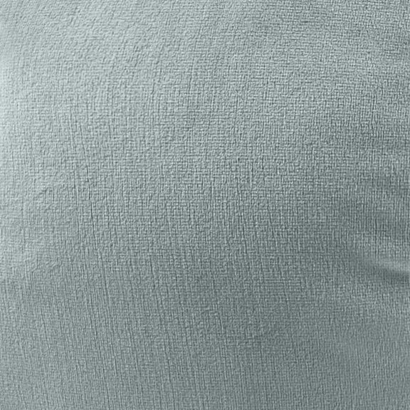 Close-up of beige textured fabric on a round Boba-style pillow