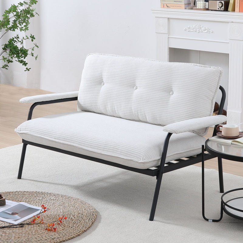 White metal frame sofa with striped seat and padded, buttoned backrest