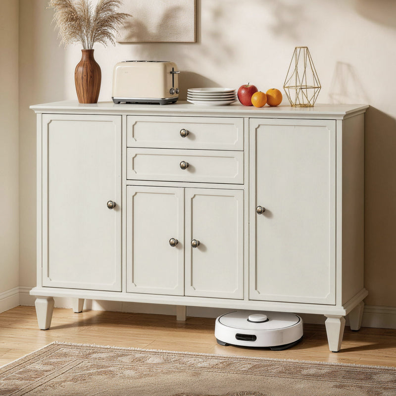White sideboard buffet with four doors and two drawers, shown in a home setting