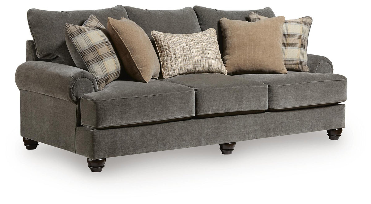Dark gray fabric sofa with three-seat bench, rolled arms, and mixed throw pillows