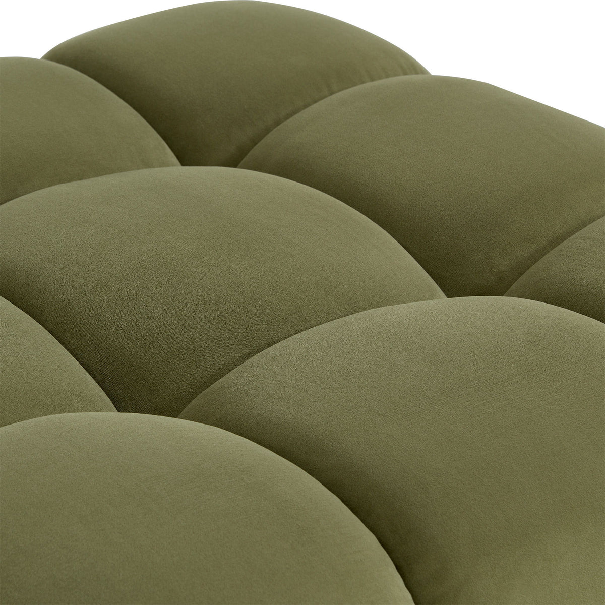 Olive green chair upholstery close-up with curved tufted cushion segments