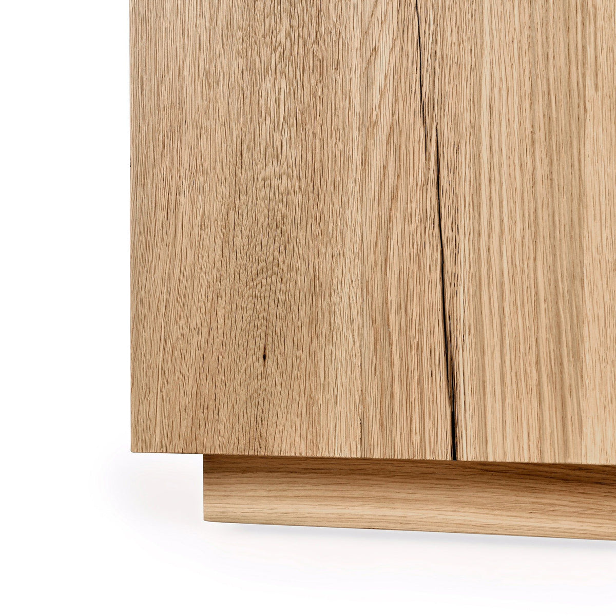 Light-brown square end table corner with wood grain and stepped base