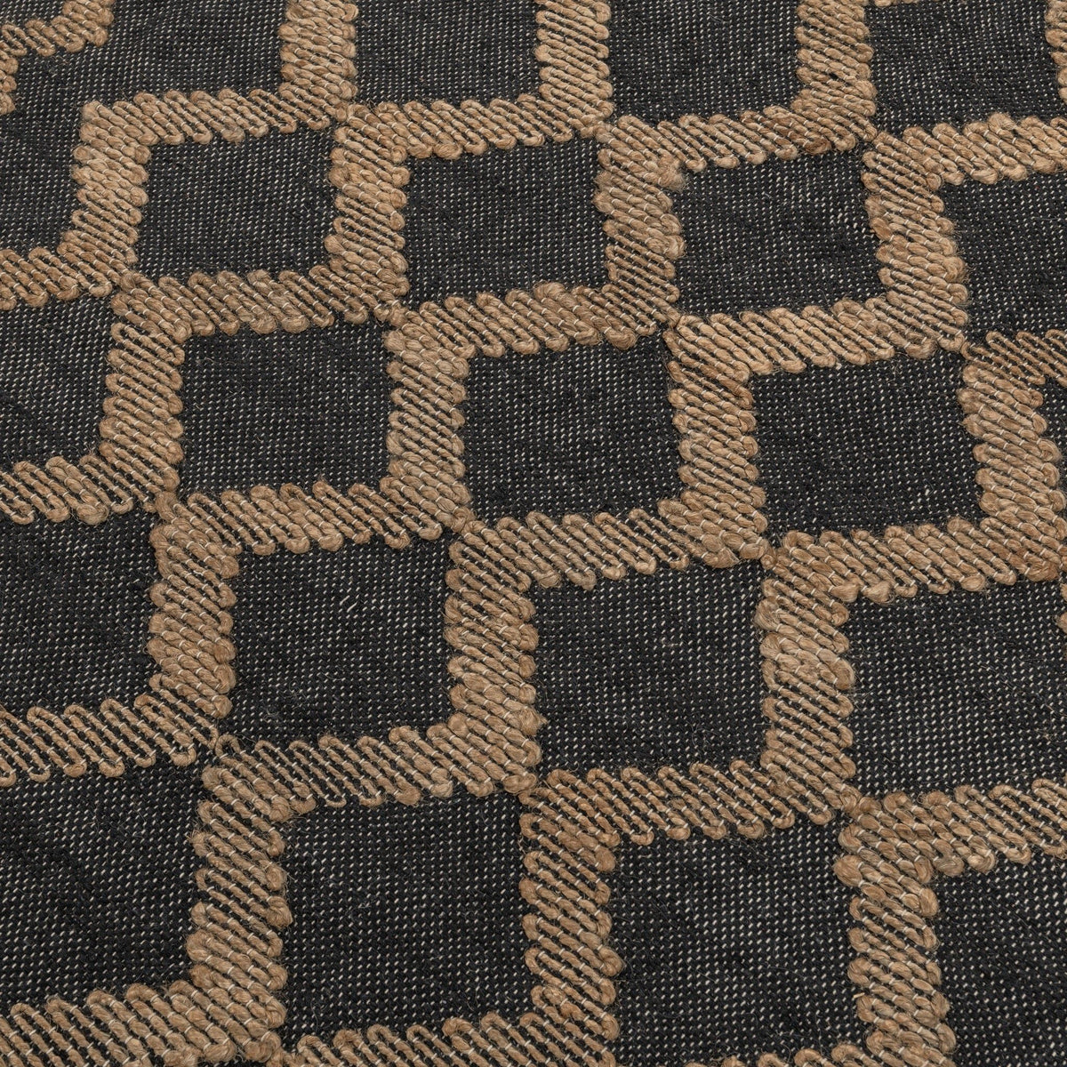 Close-up of rug texture: dark ground with natural chunky diamond blocks