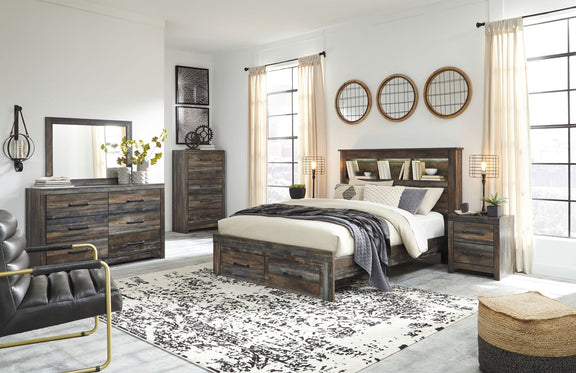 Panel bookcase bed with open shelves and side drawers, dark wood frame in a styled room.