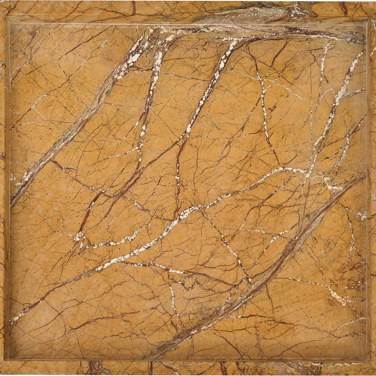 Yellow marble tray with bold dark veining across the interior surface.