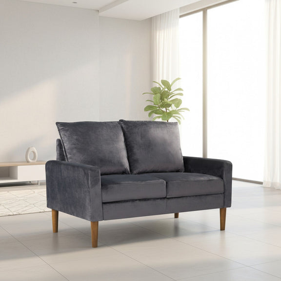 Upholstered 2-seater loveseat sofa in dark gray with two back cushions and tapered wooden legs
