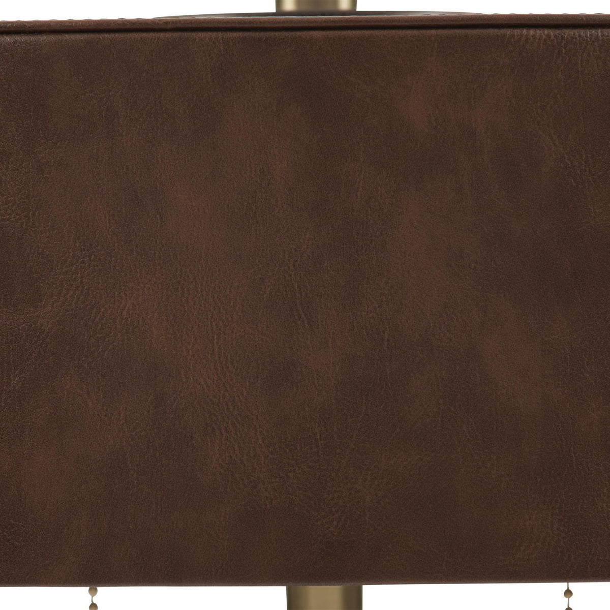 Close-up of brown drum shade fabric on a metal table lamp
