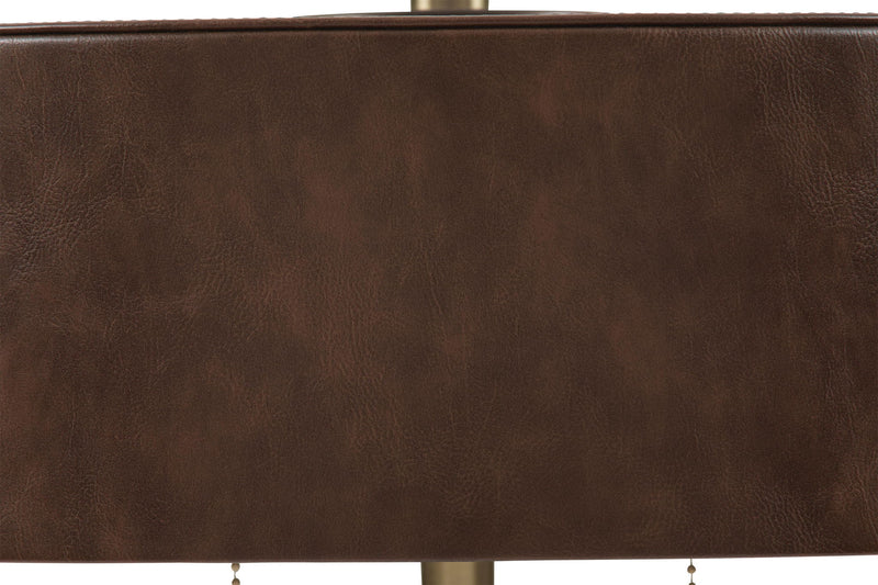 Close-up of brown drum shade fabric on a metal table lamp