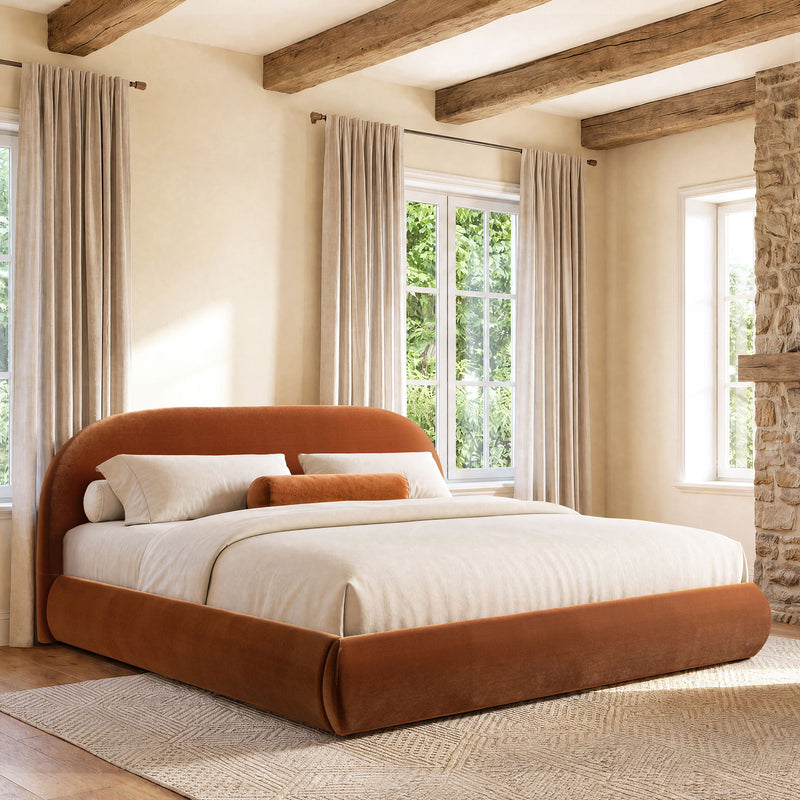 Brown upholstered platform bed with rounded headboard and low profile frame