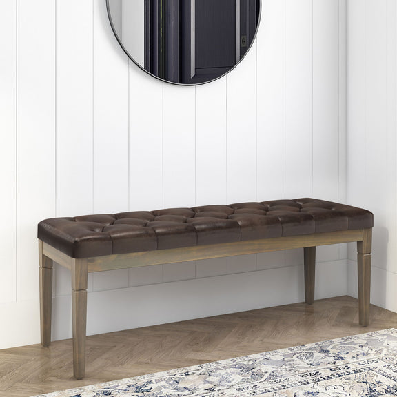 Dark brown upholstered tufted ottoman bench with wooden frame and cushioned top