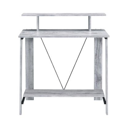 Modern writing desk with light wood finish, two tiers, and open X-brace support
