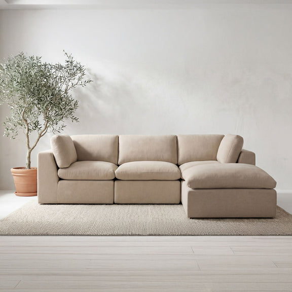 Beige fabric modular sectional with ottoman section and chaise-style side